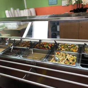 a variety of food in a buffet