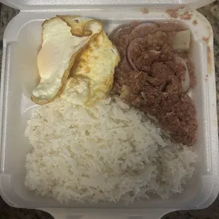 Rice with corn beef and over easy eggs
