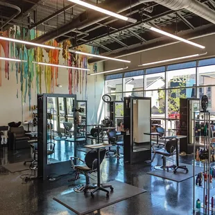 Hair washing stations next to barber and stylist stations.