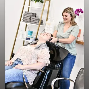 guest receiving a scalp massage