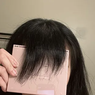 Close up of how uneven my bangs were cut