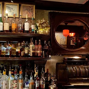 a bar with liquor bottles on shelves