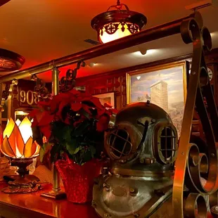 an antique diving helmet on a bar