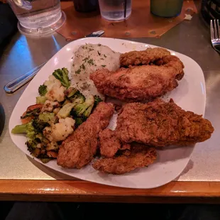 The fried chicken with mashed potatoes, gravy and mixed veggies