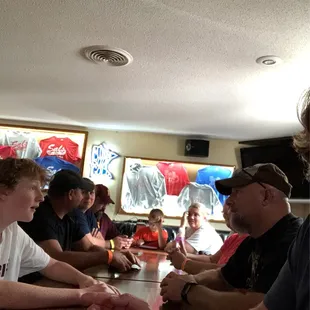 a group of people sitting at a table