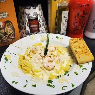 a plate of pasta with shrimp