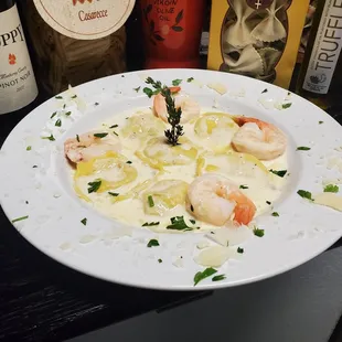 a plate of pasta with shrimp