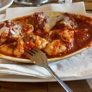 Moistest meatballs swimming in marina and mozzarella