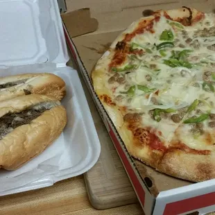 Cheese Steak sandwich and a Sausage, Peppers, and Onion Pizza.