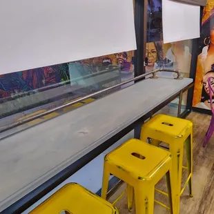 a row of yellow stools