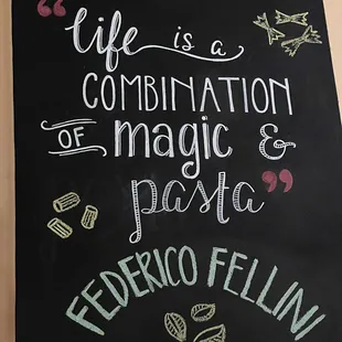 a chalk board with a quote