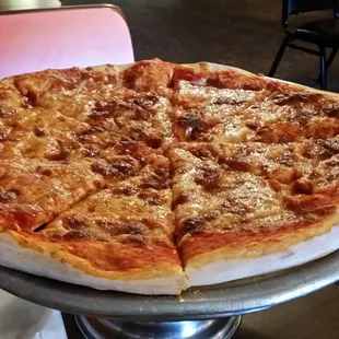 a cheese pizza on a platter