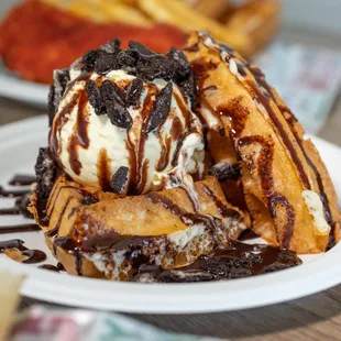 a waffle with ice cream and chocolate sauce