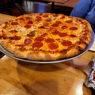 half Pepperoni and half Sausage pizza