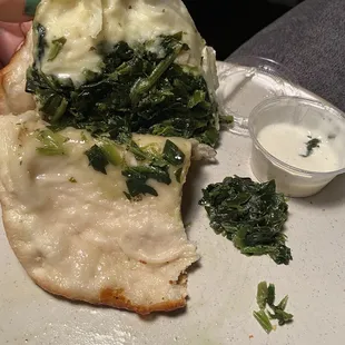 Spinach "roll"? Aka gooey dough filled with soggy canned spinach &amp; rubbery cheese. It tastes as good  as it sounds and looks.