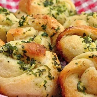 a close up of a basket of bread rolls