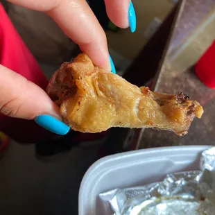 a person holding a piece of food