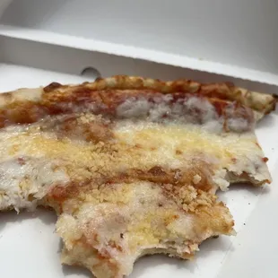 A purchase of cheese pizza with parmesan sprinkle on top. The crust was soft and crunch and light. The cheese was a chewy-gewy yum.