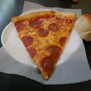 Classic Pepperoni slice with a Garlic Knot.