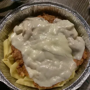 Pasta, meat sauce, melted sliced cheese.