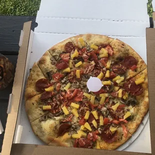 Andy&apos;s Pizza, super thin crust, Olive oil,pepperoni,mushrooms,tomatoes, pineapples and Parmesan cheese. Amazing!!!
