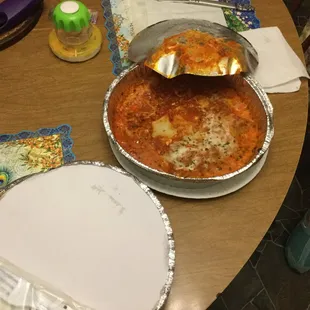 Our 38 dollar lasagna dinner looks like vomit, tastes like salt.
