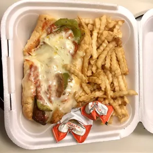 Uncle Sal's Italian Sausage on Garlic Bread with marinara, sweet peppers and mozzarella cheese. French Fries on the side.