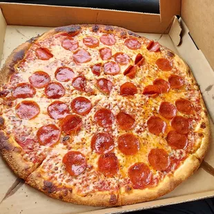 a pepperoni pizza in a box