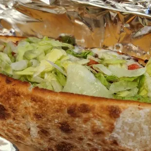 a hot dog wrapped in foil