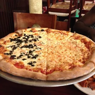 Large pizza half cheese half black olives &amp; buffalo wings yum. Huge portions &amp; delicious!