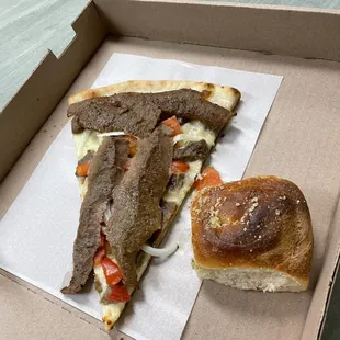 a half eaten pizza in a box