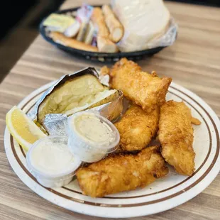 Cod with baked potato and bread basket
