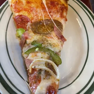 Slice of deluxe pizza