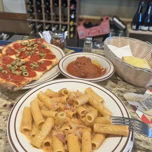 Rigatoni alla vodka with ground sausage added and a side of meatballs. Both of them are so good!! The pizza is delicious.