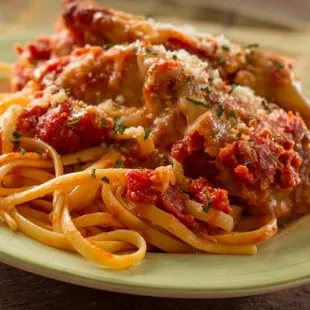 a plate of spaghetti and meat