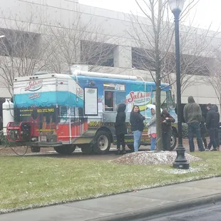people ordering food from a food truck