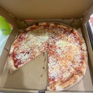 a pizza in a cardboard box