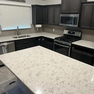 a kitchen with granite counter tops