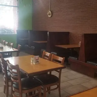 a dining area with tables and chairs