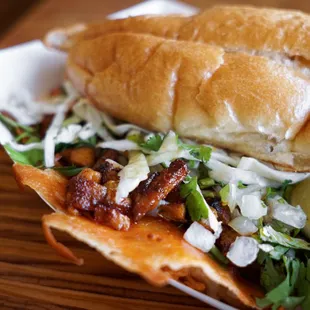 a sandwich with a lime wedge