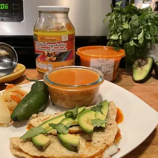 Chile de arbol salsa, pickled vegetables, produce and dairy from the market.