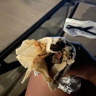 The saddest burrito in my entire life. A churro is fatter that this thing...