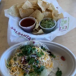 One steak taco with chips and guacamole.  super fresh and a great value!
