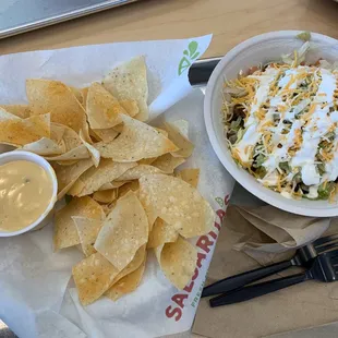 Chicken bowl with chips and Queso