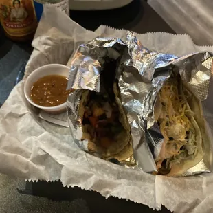 a burrito wrapped in aluminum foil