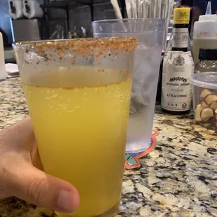 Cider rimmed with tajin seasoning