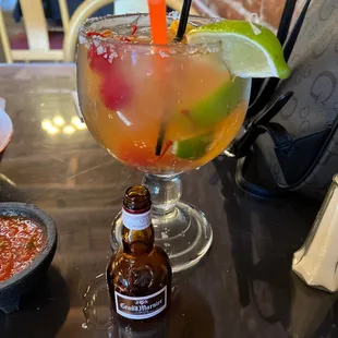a bottle of beer and a margarita