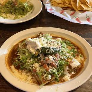 Salsa's special. Chicken enchilada and chicken burrito. Guacamole app in the background. All were excellent!
