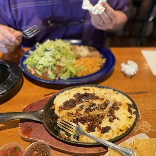 Sopes with chile verde-far dish, and queso fundito