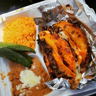 Birria with cheese taco plate, and grilled jalapenos.